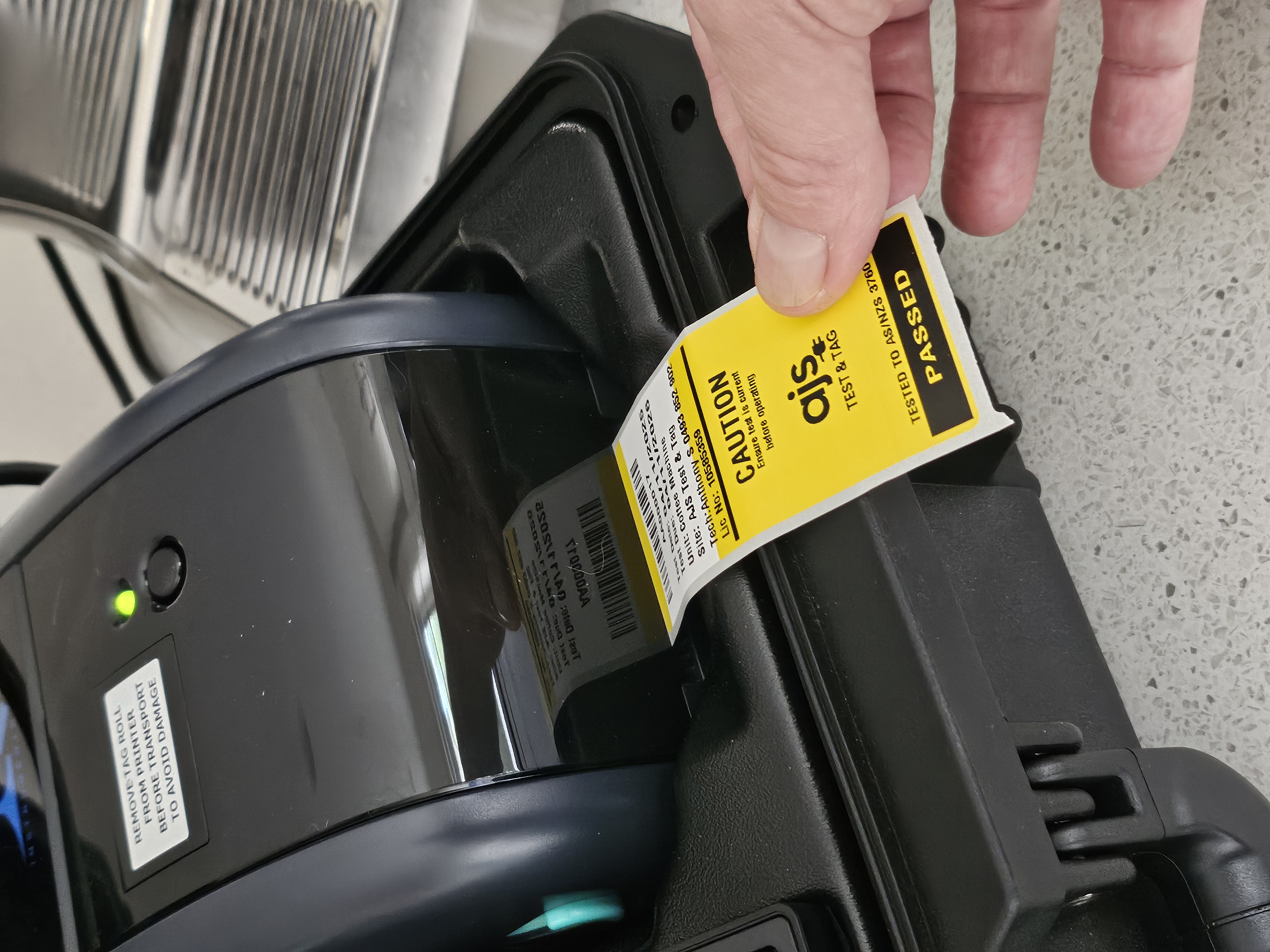 Workshop testing setup with PAT tester and keyboard